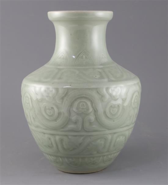 A Chinese celadon glazed archaistic moulded vase, Qianlong underglaze blue seal mark to base, probably 19th century, H.30cm